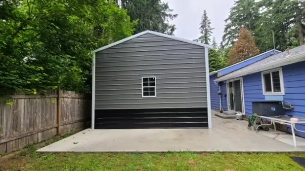A-frame enclosed gray carport with window