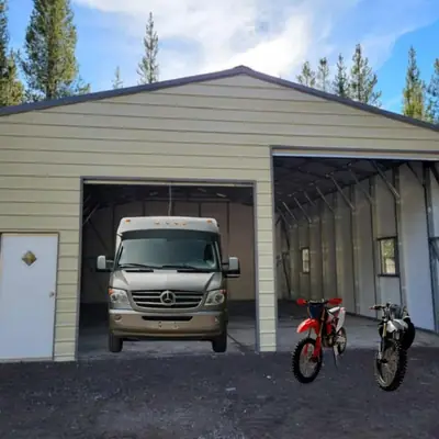 Enclosed RV storage building with side carport